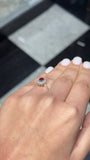 Oval Ruby and Diamond Halo Ring