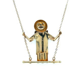 Man on Swing with Diamond Buttons Necklace